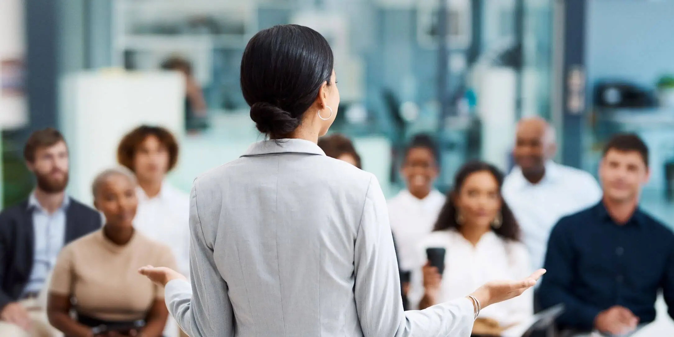 behind view of woman giving a presentation