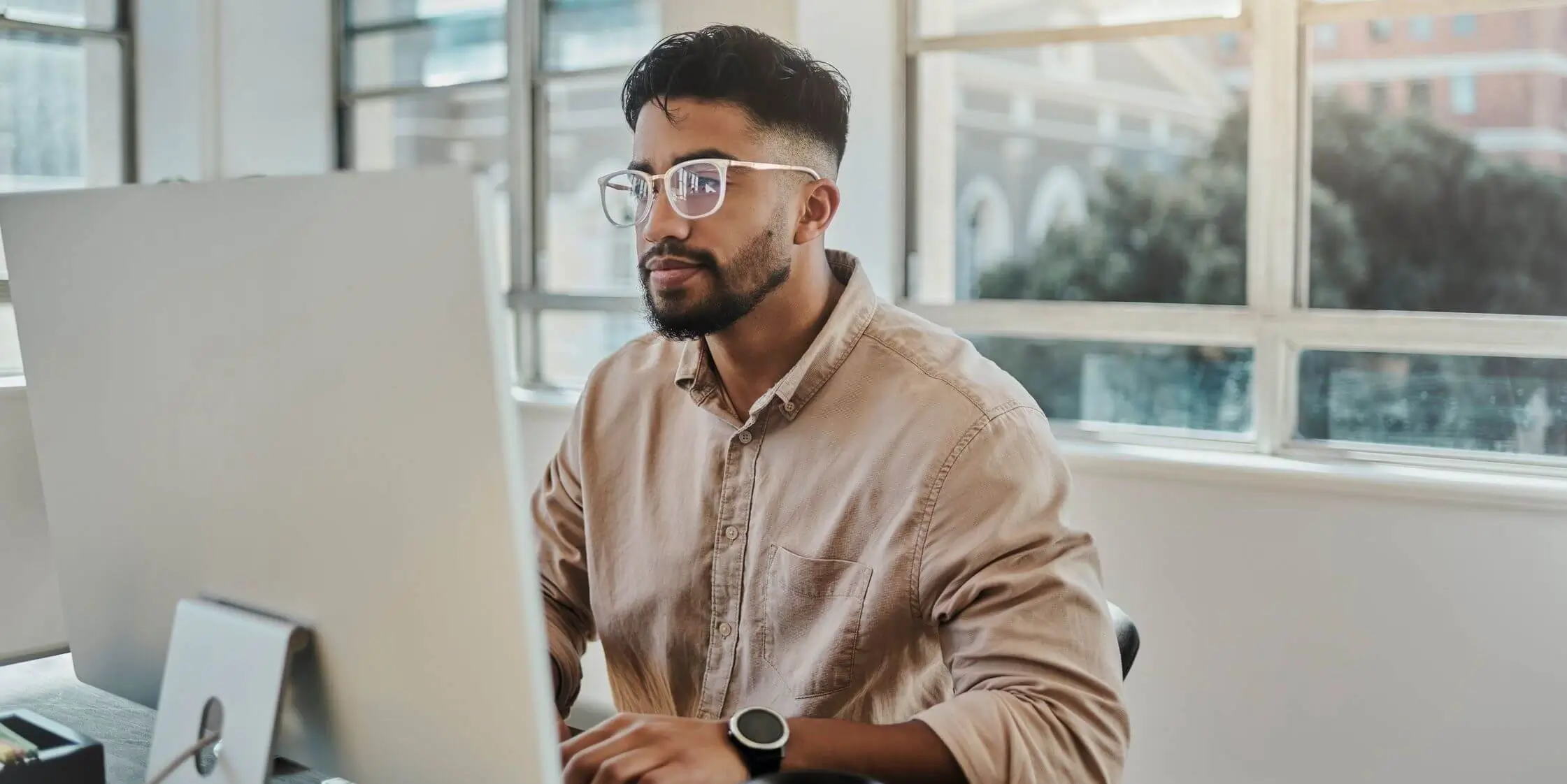 man working diligently on computer